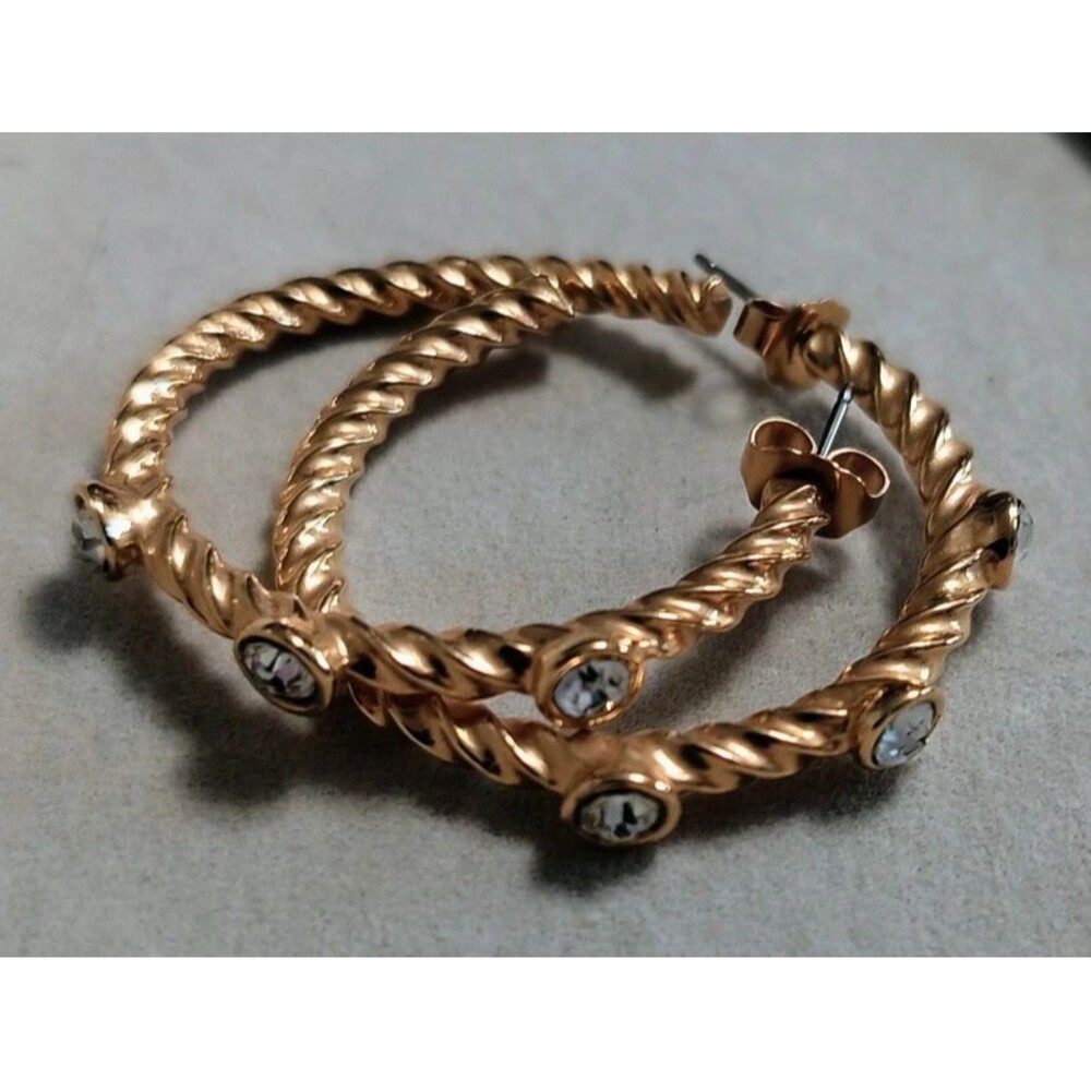 Gold tone rope earrings with CZs